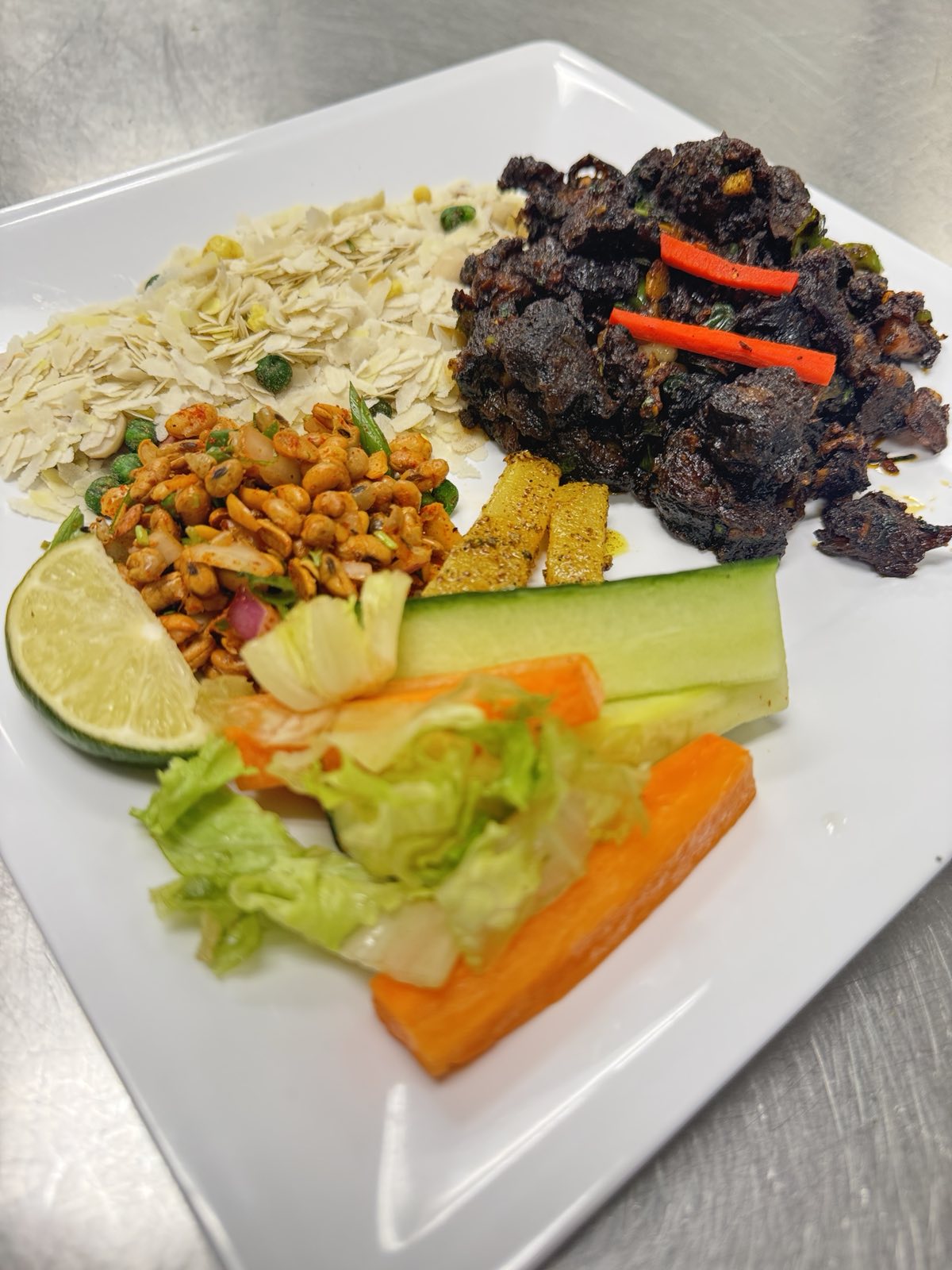 Buff sukuti with chiura and peanuts